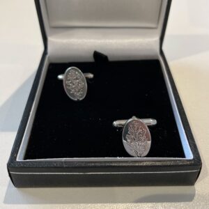 Solid Silver oval cufflinks with the Gin Guild juniper sprig insignia.